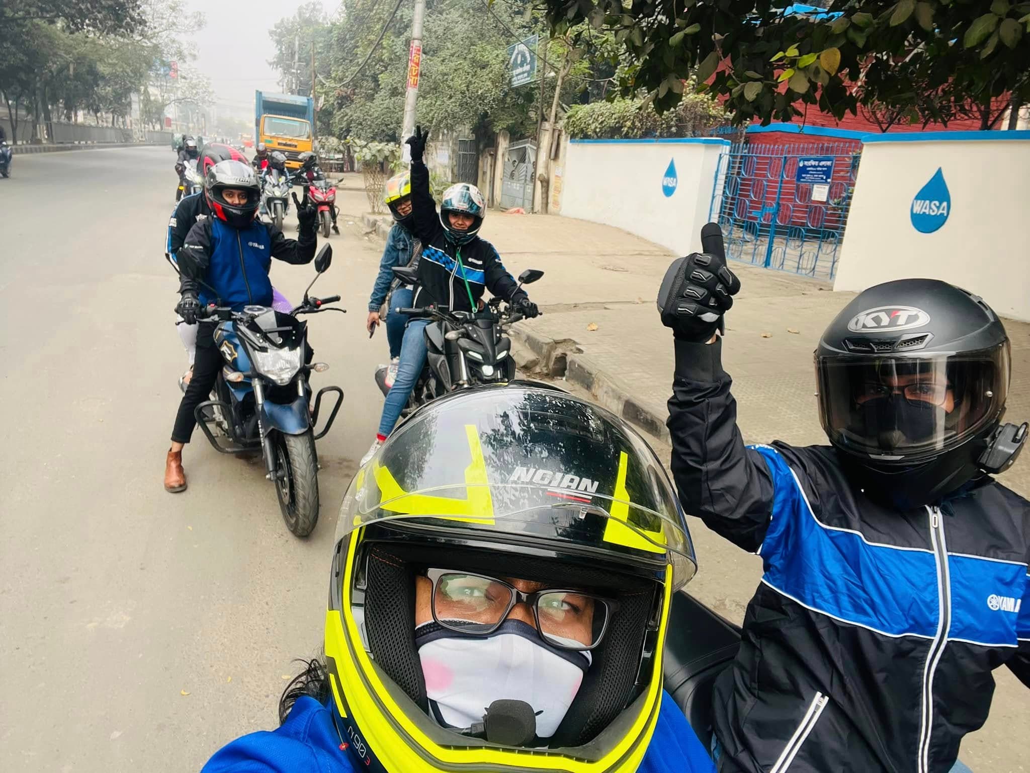 Riders taking a selfie during a city portion of a group tour.