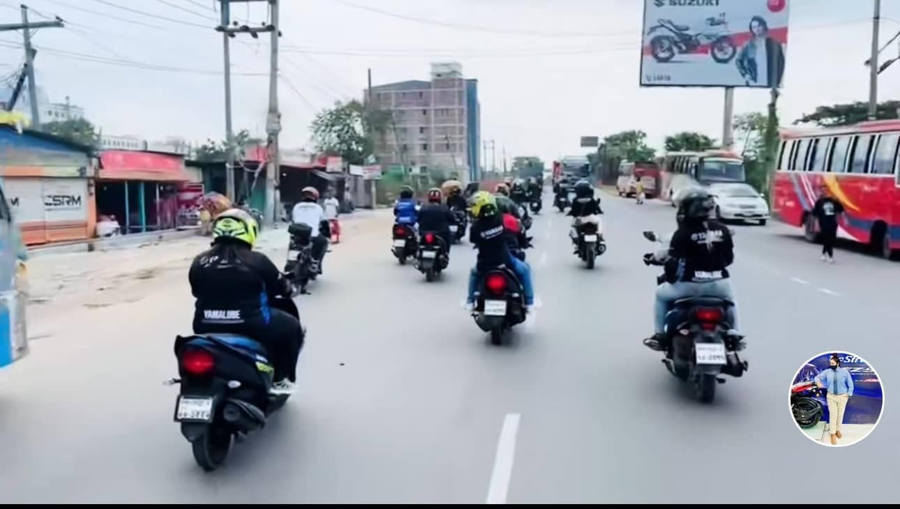 A convoy of motorcycles traveling together on a highway.