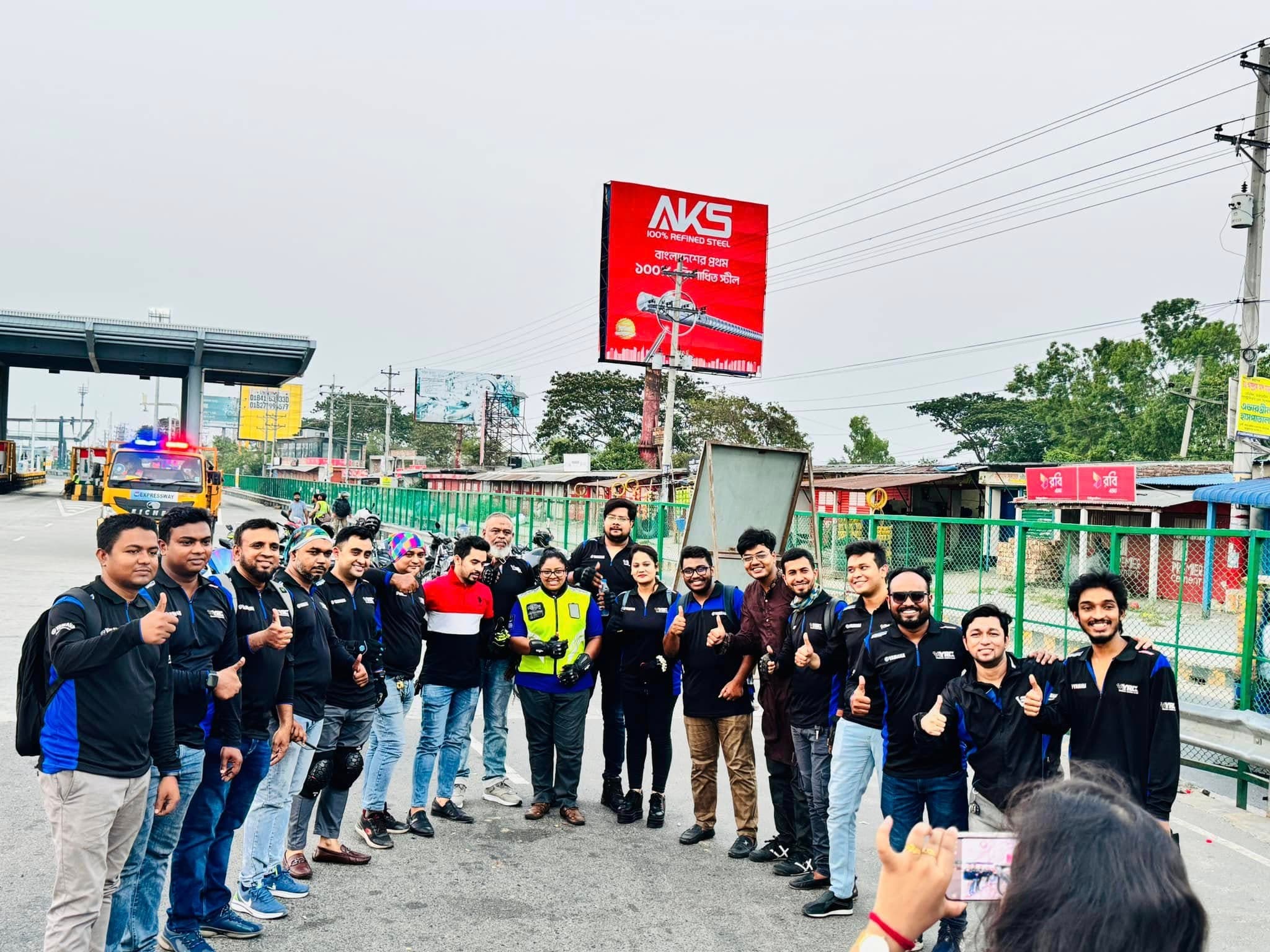 Yamaha riders and motorcycles lined up at a toll plaza.