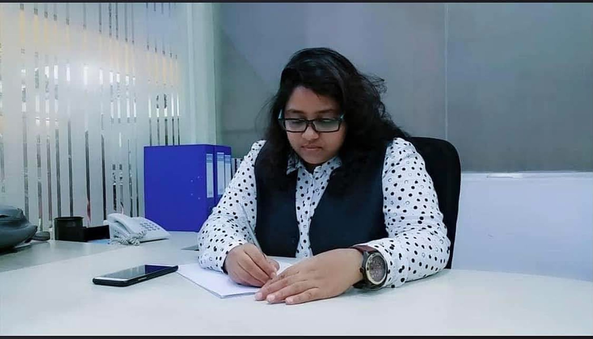 Razia Sultana Lina at her desk.